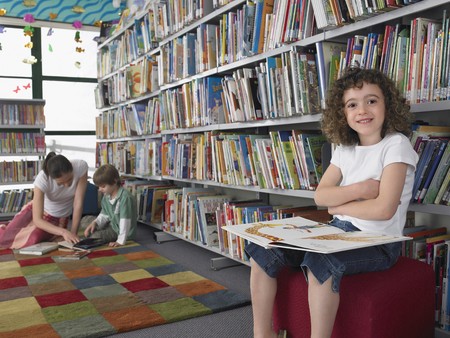 Elementary Student Reading in Library