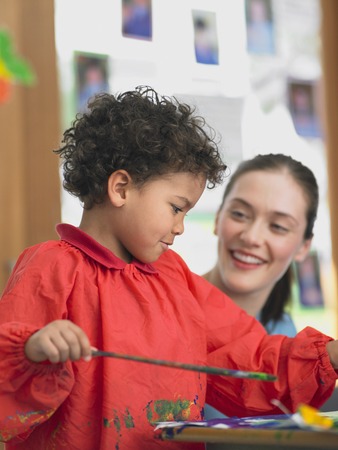 Elementary Student and Teacher in Art Classの写真素材