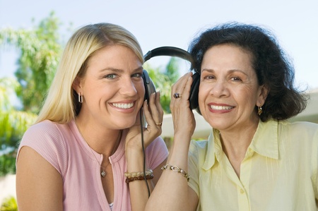 Mother and Daughter Sharing Headphones