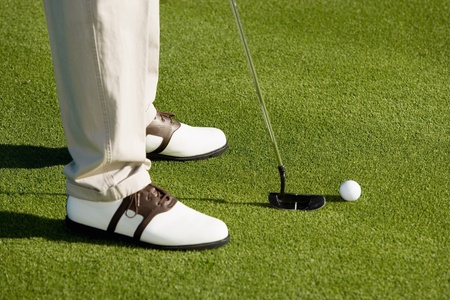 Golfer putting on green (low section)