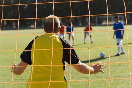 Goalkeeper defending back viewの写真素材