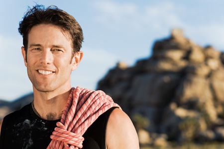 Rock climber with Rope on Shoulder (portrait)の写真素材
