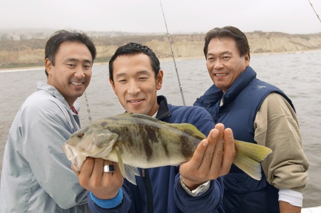 Sport fisherman displaying fish