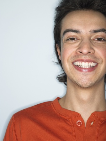 Man smiling in studio head and shouldersの写真素材