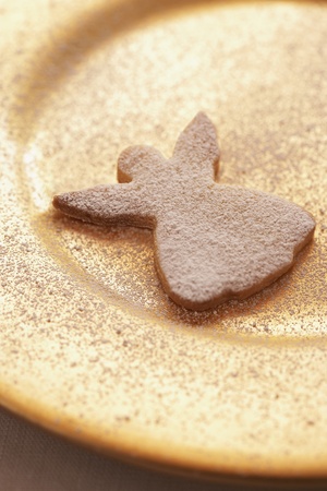 Angel Christmas cookie on plate close-upの写真素材