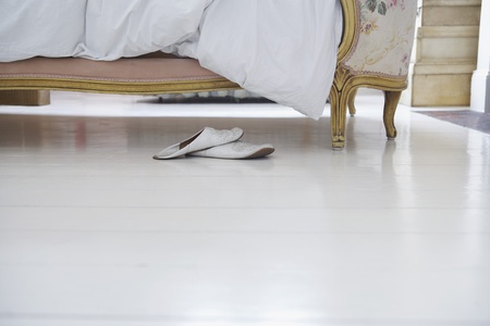 Pair of slippers by bedの写真素材