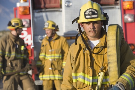 Firefighter carrying hose