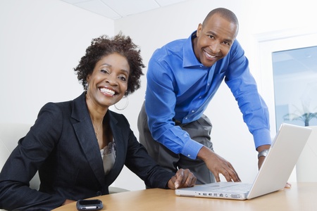 Businesspeople Using Laptopの写真素材