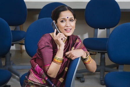Indian Businesswoman Using Cell Phoneの写真素材