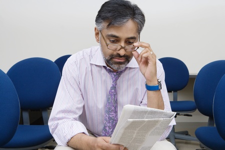 Businessman Reading Newspaperの写真素材