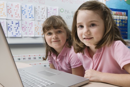 Little Girls Using a Laptopの写真素材
