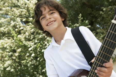 Little Boy Playing Guitarの写真素材