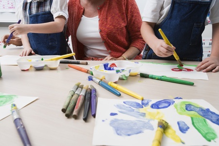 Teacher Watching Students Paint