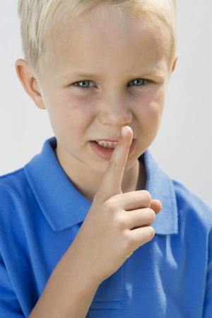Boy with Finger on Lipsの写真素材