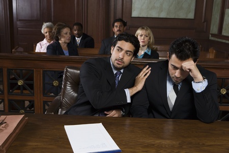 Two men sitting in courtの写真素材