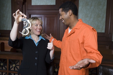 Lawyer and client celebrating in courtの写真素材