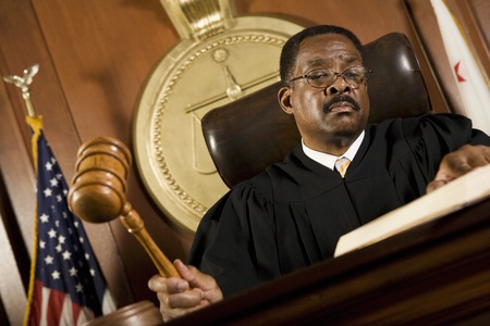 Middle-aged judge forming sentenceの写真素材