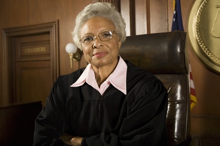 Female judge sitting in court portraitの写真素材