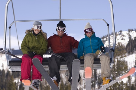 Three Skiers on Chair Liftの写真素材