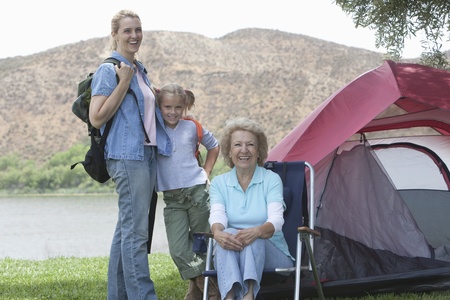 Mother daughter and grand-daughter outside tent
