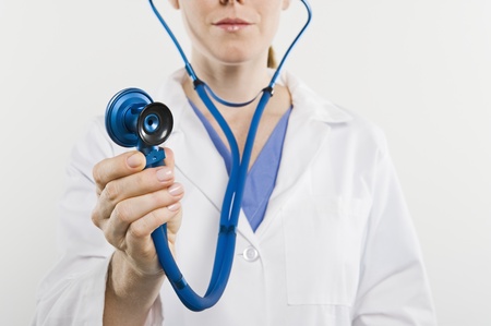 Doctor with stethoscope mid sectionの写真素材