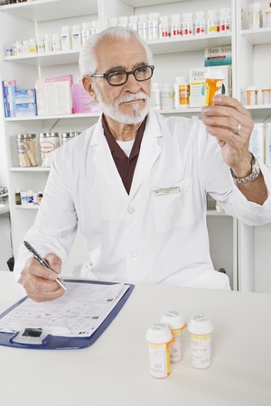 Male pharmactist working in pharmacyの写真素材