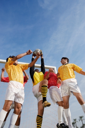 Soccer Players Competing for the Ballの写真素材