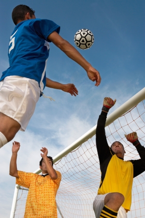 Soccer Players Competing for the Ballの写真素材