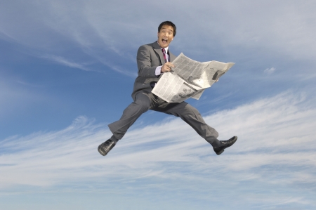 Businessman Reading a Newspaperの写真素材