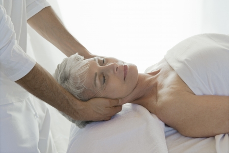 Senior woman having massageの写真素材