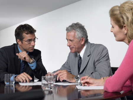 Three business colleagues in conference meetingの写真素材
