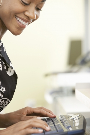 Woman using computer in officeの写真素材
