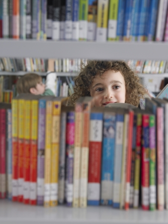 Elementary Student Reading in Libraryの写真素材