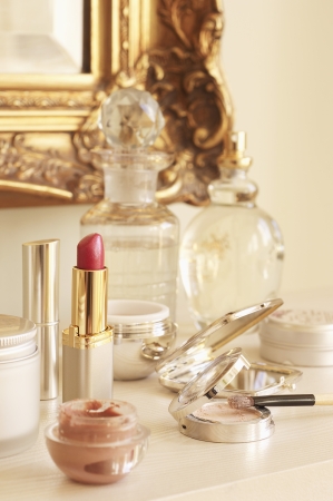 Table With Cosmetics and Wall Mirrorの写真素材