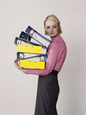 Businesswoman Carrying Empty Bindersの写真素材