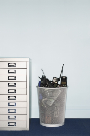 Cell Phones Thrown Away in Garbage Canの写真素材