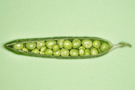 Open Pea Pod With Peas Insideの写真素材