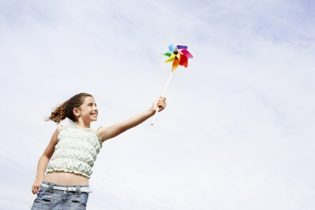 Little Girl Holding a Pinwheelの写真素材