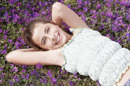 Little Girl in a Field of Flowersの写真素材
