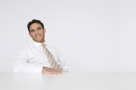 Businessman Sitting at Tableの写真素材