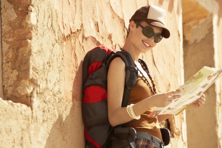 Hiker Reading Map by Farmhouseの写真素材