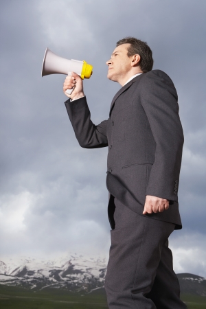 Businessman Speaking Through a Megaphoneの写真素材