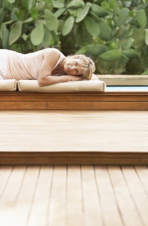 Woman Lying by Poolの写真素材