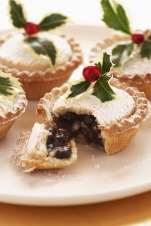 Decorated mince pies on plate close-upの写真素材