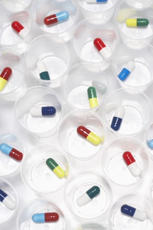 Capsule pills in plastic cupsの写真素材