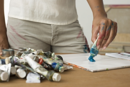 Artist Squeezing Paint onto Paletteの写真素材