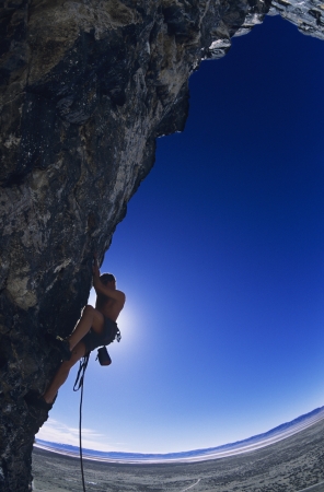 Rock climber on cliff faceの写真素材
