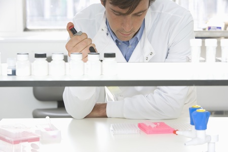 Scientist taking samples in laboratoryの写真素材