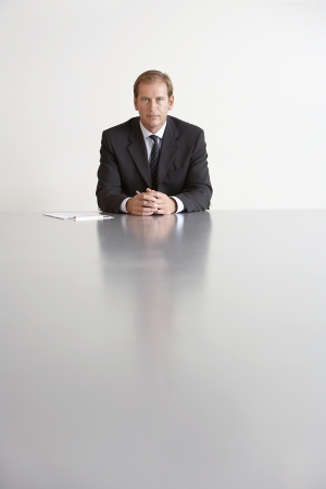 Businessman Sitting in Conference Roomの写真素材