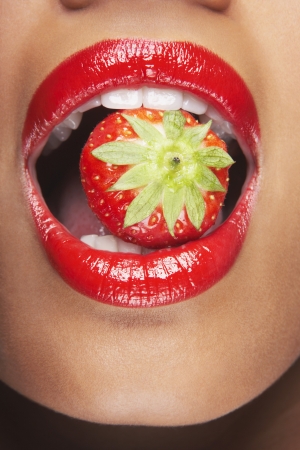 Woman Eating Strawberryの写真素材